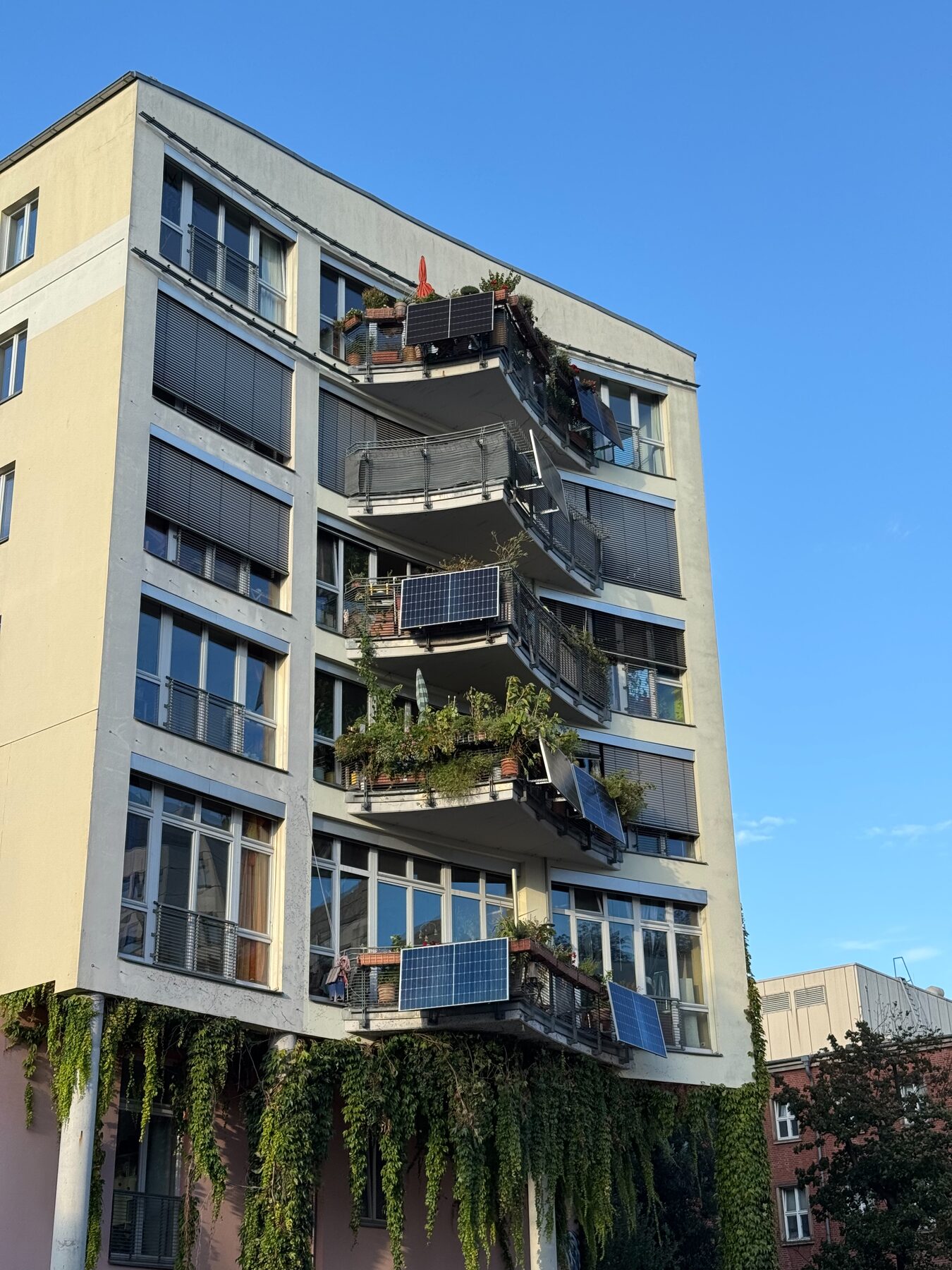 Apartment balcony with plug-in solar panels mounted to railing